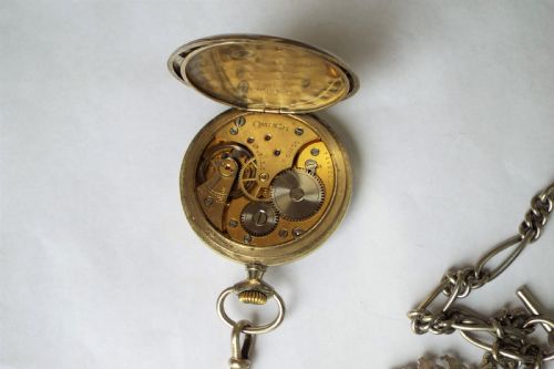 fig 2. 1930s Omega pocket watch and double albert