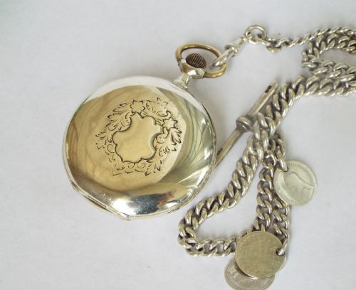 fig 1. Antique silver Omega pocket watch and chain