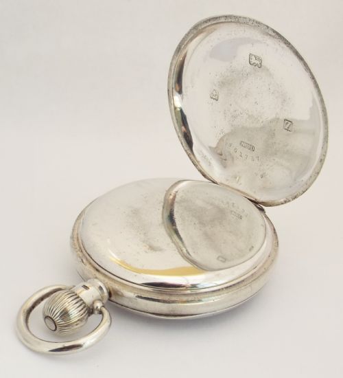 fig 2. A 1920s silver Visible stem winding pocket watch.