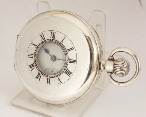 A 1920s Silver Half Hunter Waltham Pocket Watch.
