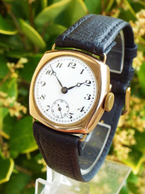 fig 1. 9ct gold Buren cushion cased wrist watch, 1930