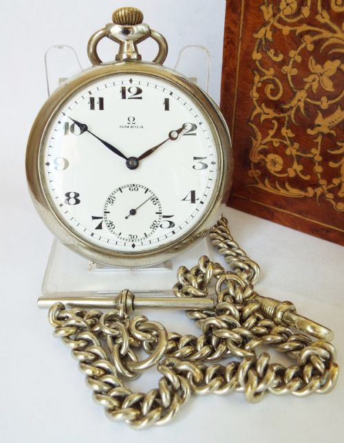 An Antique 1917 Omega Pocket Watch and Chain .