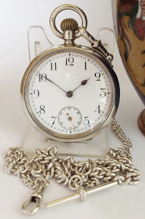 An Antique Silver Omega Pocket Watch and Chain.