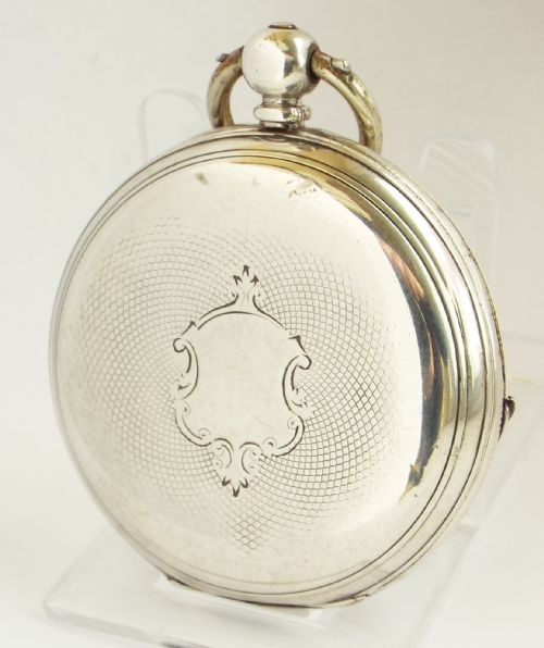 fig 1. An antique silver full hunter pocket watch.