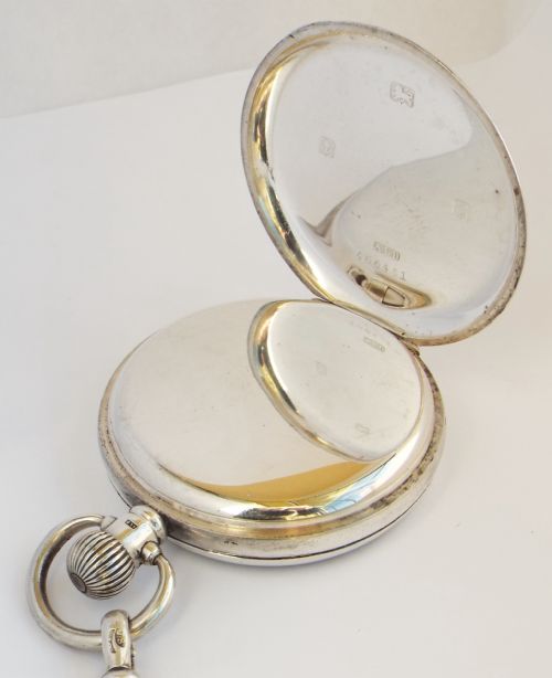 fig 2. A 1920s silver pocket watch and chain.