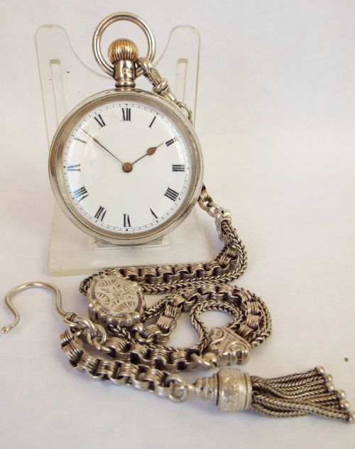 A Lady’s Antique Silver Waltham Fob Watch and Chain.
