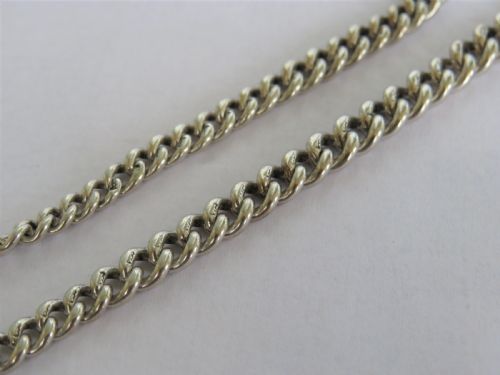 fig 1. Antique silver Omega pocket watch and chain