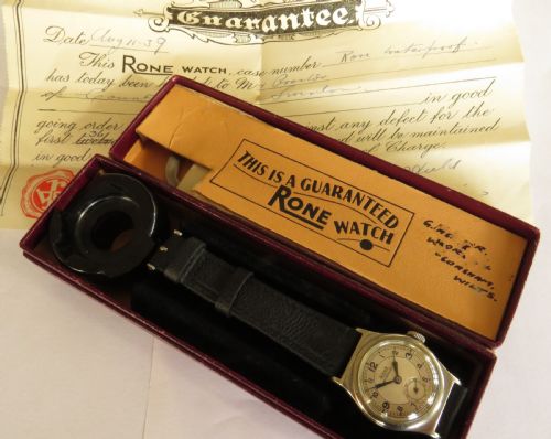 fig 1. 1930s Rone wrist watch with box, papers and tools
