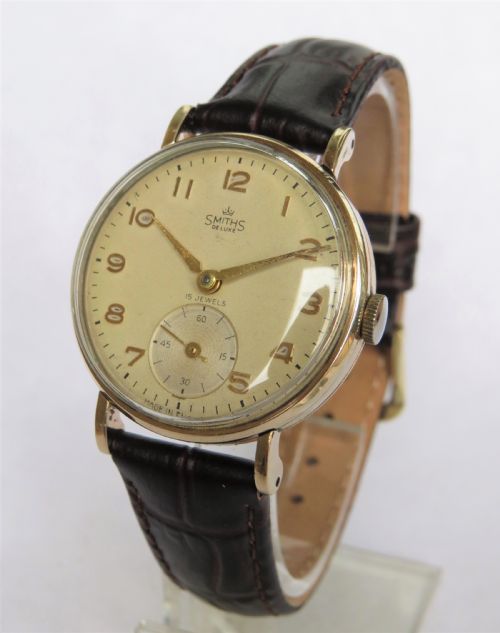 Gents 9ct Gold Smiths De Luxe Wrist Watch, 1957