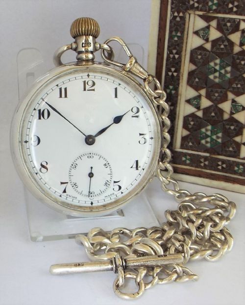 A 1920s Silver Cyma Pocket Watch with Chain.