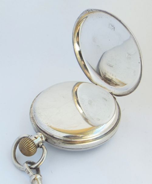 fig 2. A 1920s silver Cyma pocket watch with chain.