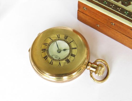 A 1940s Garrard Half Hunter Pocket Watch.