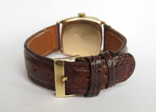 fig 2. Mid-size 9ct gold cushion cased wrist watch, 1931
