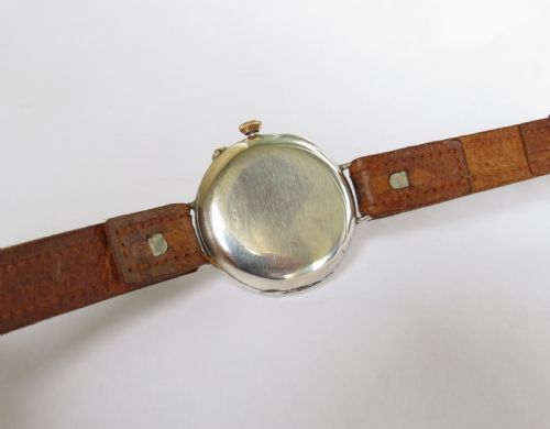 fig 3. 1909 gents silver Longines wrist watch, Sir John Bennett