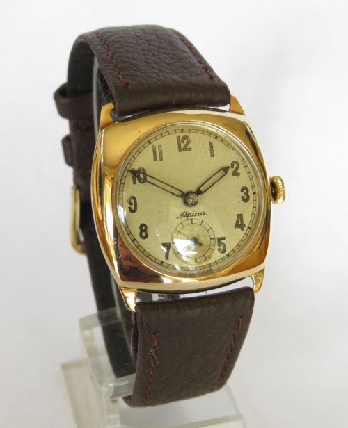 fig 1. 9ct gold cushion cased Alpina wrist watch, 1945