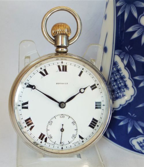 A 1920s Silver Pinnacle Stem Winding Pocket Watch.