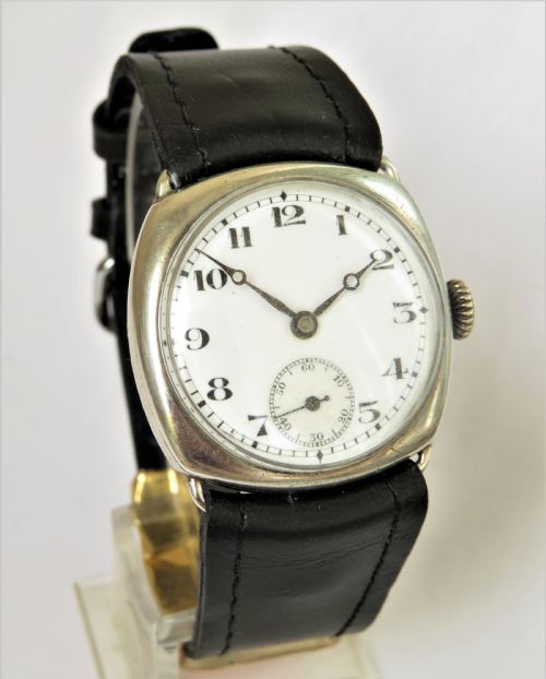 fig 1. Gents silver cushion cased wrist watch, 1927