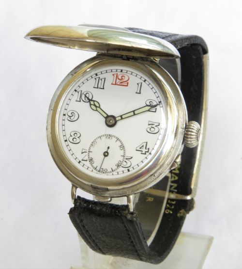 fig 1. Gents silver half hunter wrist watch, 1925