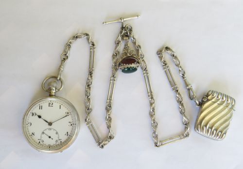 fig 1. 1929 silver pocket watch with chain and vesta case