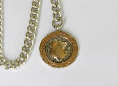 fig 1. 1909 silver pocket watch chain, 9ct gold & silver fob