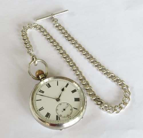 fig 1. Antique silver Longines pocket watch retailed by J W Benson, and chain
