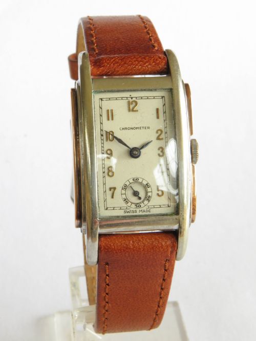fig 1. Art Deco stainless steel and rose gold curvex chronometer wrist watch