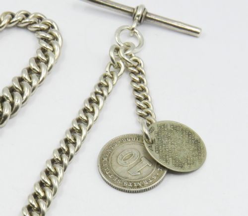 fig 1. 1917 silver watch chain by Edwin Page, with fobs