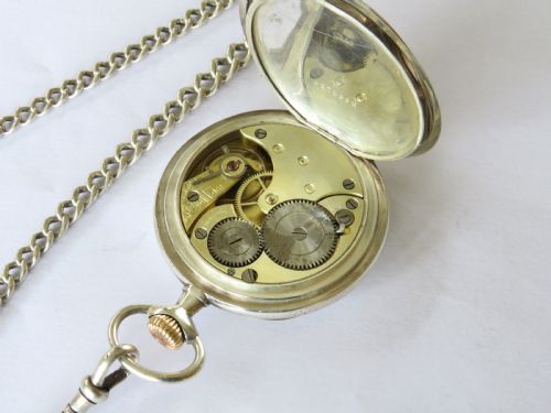 fig 1. Antique silver Omega pocket watch and chain
