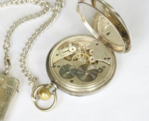 fig 3. Silver Cyma pocket watch, chain and vesta
