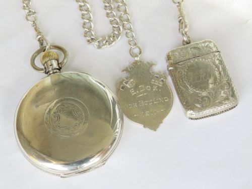 fig 4. Silver Cyma pocket watch, chain and vesta