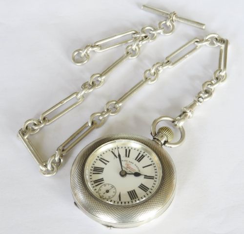 fig 1. Antique silver Omega pocket watch and chain