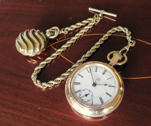 fig 1. Antique Waterbury Watch Co pocket watch & chain
