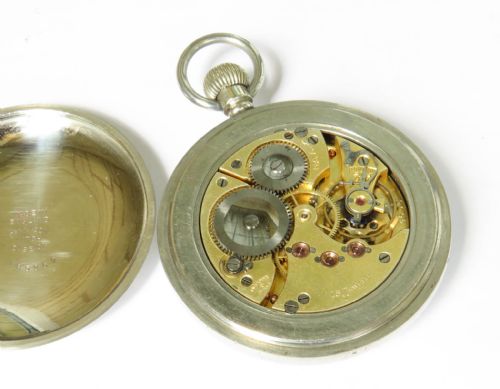 fig 2. An antique open-face silver-toned pocket watch featuring a white enamel dial with black Arabic numerals and a subsidiary seconds dial.