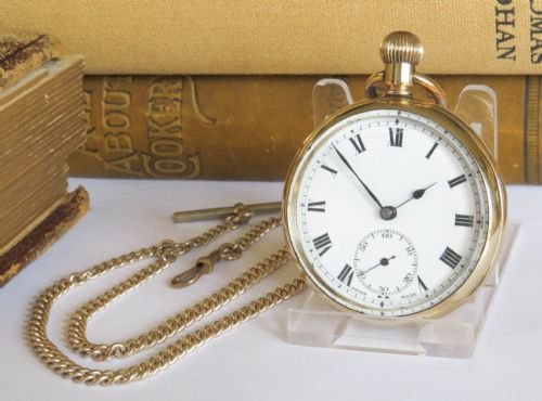 1930S SWISS OPEN FACED POCKET WATCH AND CHAIN