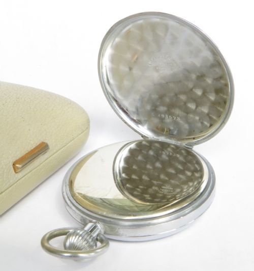 fig 2. A 1950s Bravingtons Renown open-face pocket watch with a cream dial, black Arabic numerals, and blued steel hands, set inside its cream presentation case.