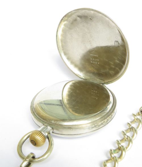 fig 1. A 1920s Cyma open-face pocket watch featuring a white enamel dial with black Arabic numerals, a sub-seconds dial, and an attached link chain with a T-bar.