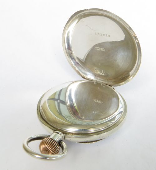 fig 2. An antique silver open-face pocket watch featuring a white enamel dial with Roman numerals and a subsidiary seconds dial.
