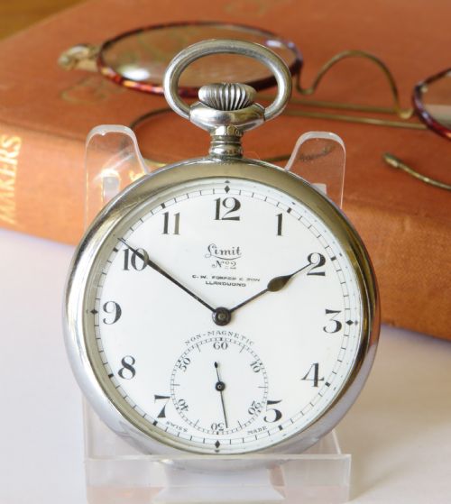 fig 1. An antique 1920s Limit No 2 open-face pocket watch featuring a white dial with black Arabic numerals and a subsidiary seconds dial.