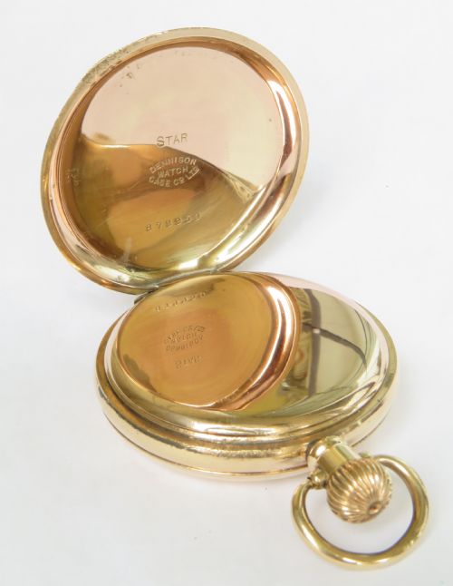 fig 1. An open gold full hunter pocket watch displaying a white enamel dial with black Roman numerals and a small seconds subdial.