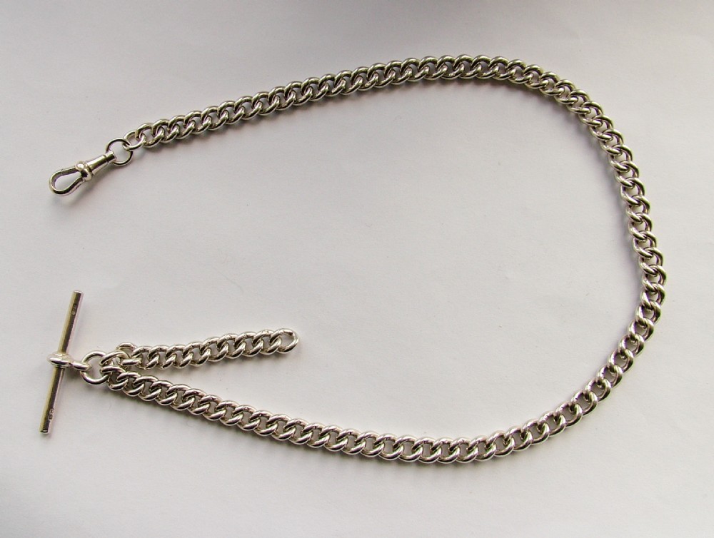 A vintage 1919 English silver watch albert.