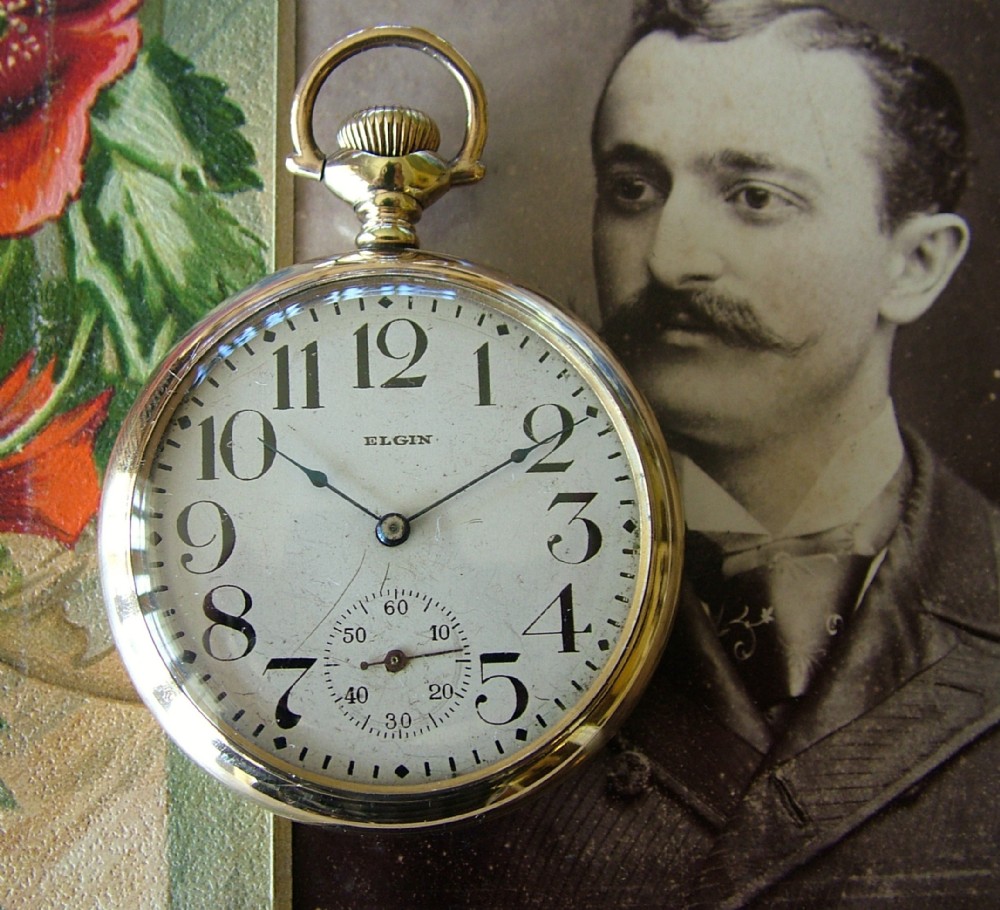 A vintage 1926 gold filled Elgin stem winding pocket watch.