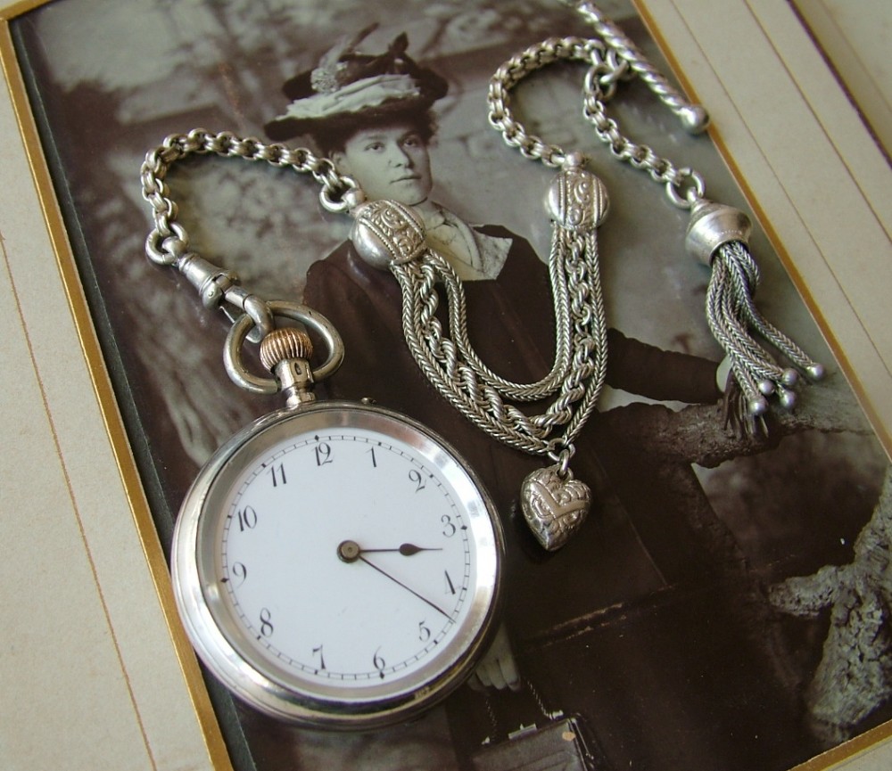 A lady’s silver fob watch and albertina