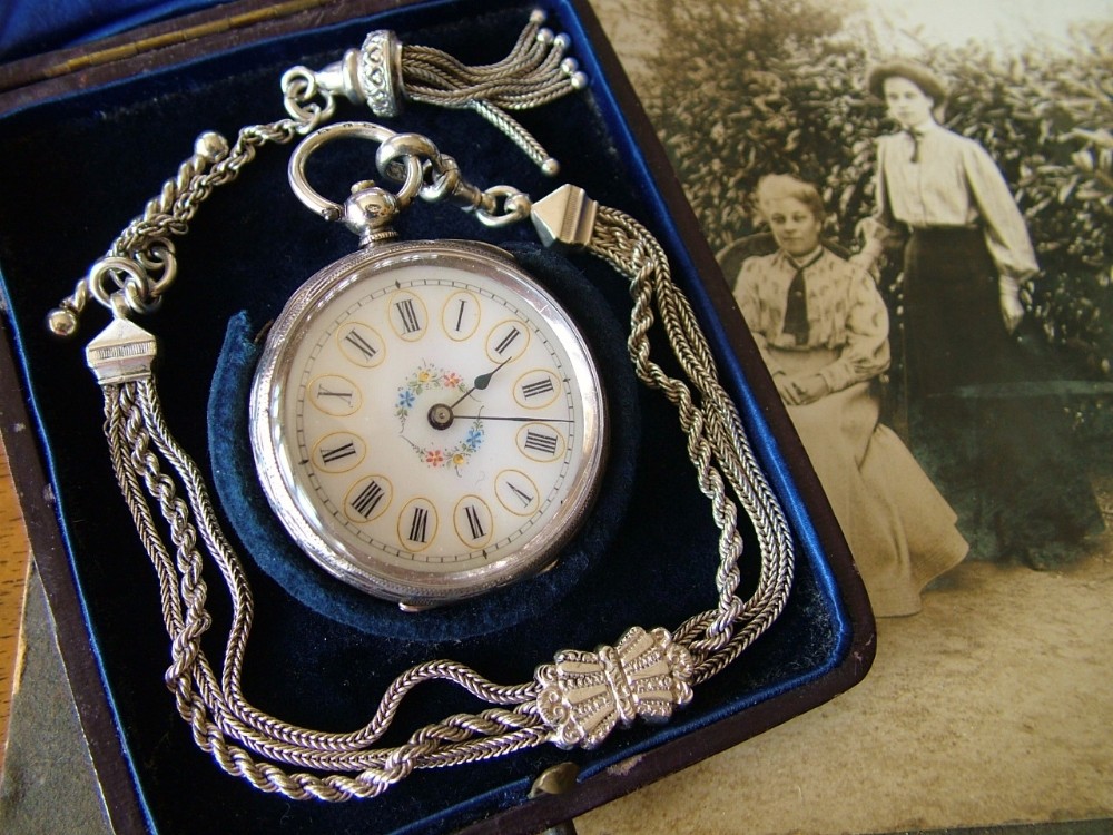 A lady’s antique silver fob watch and albertina
