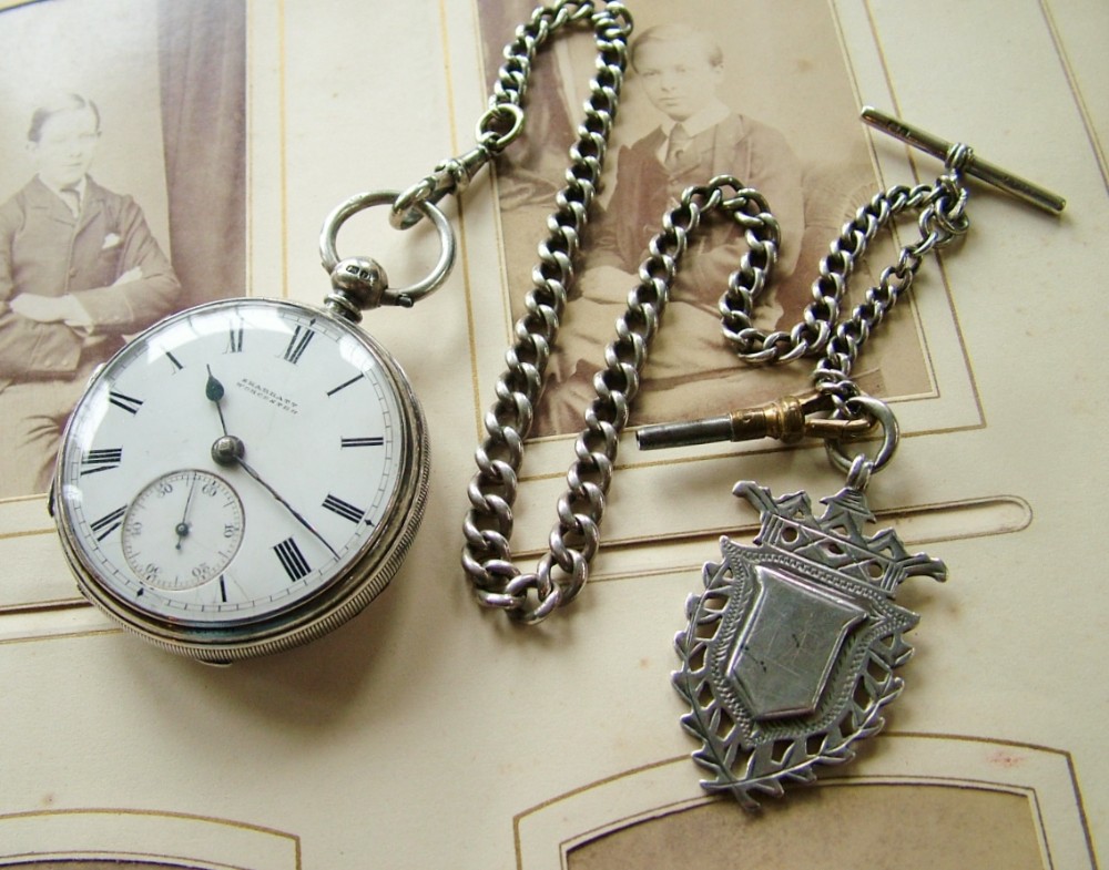 An antique silver fusee pocket watch and chain