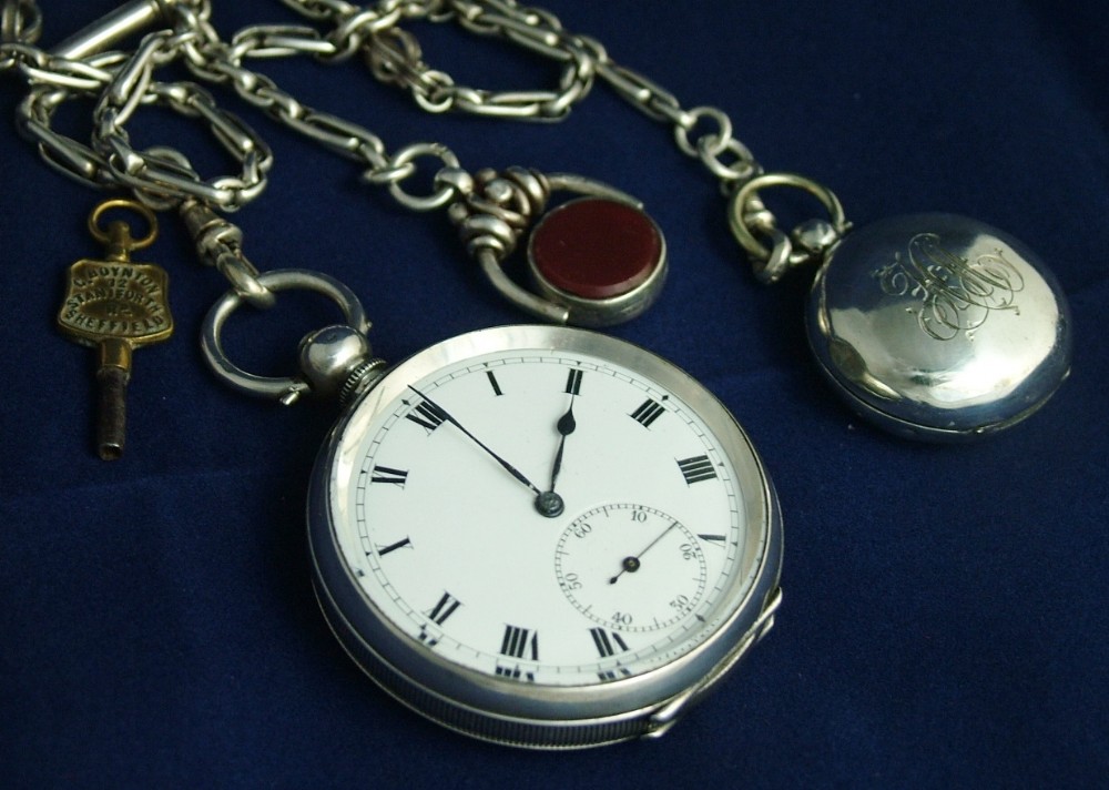 Silver Tavannes pocket watch and accoutrements