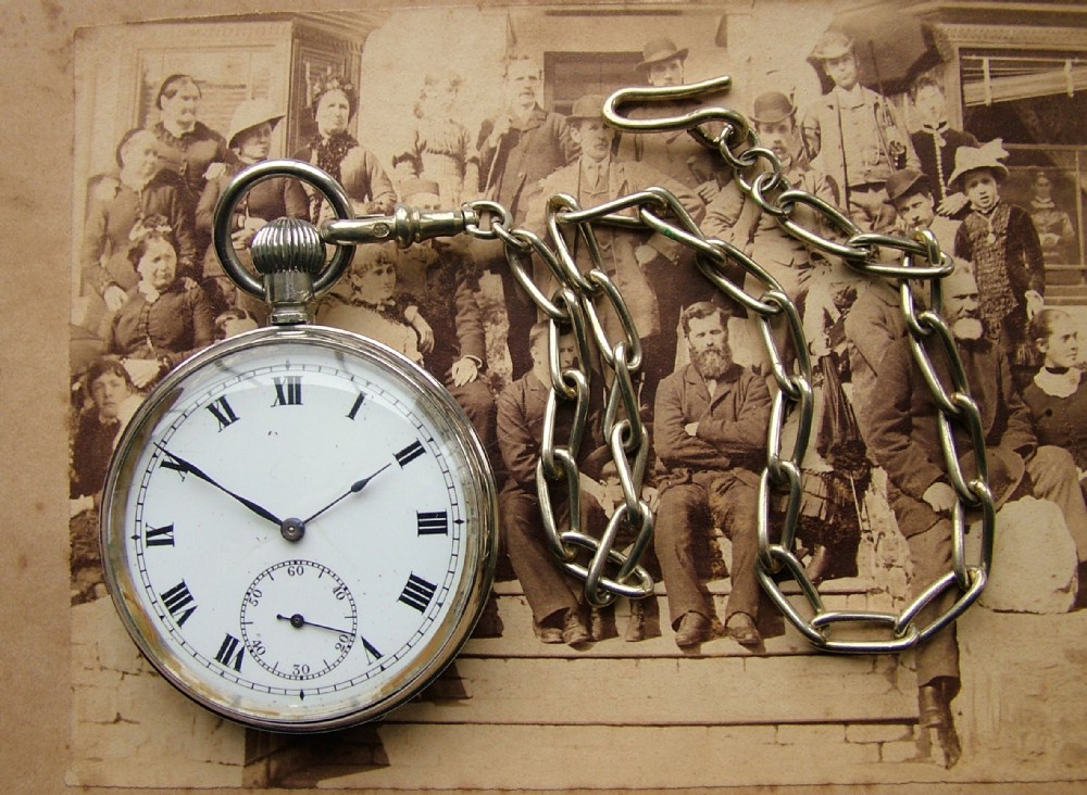 A 1920s Cyma pocket watch and chain