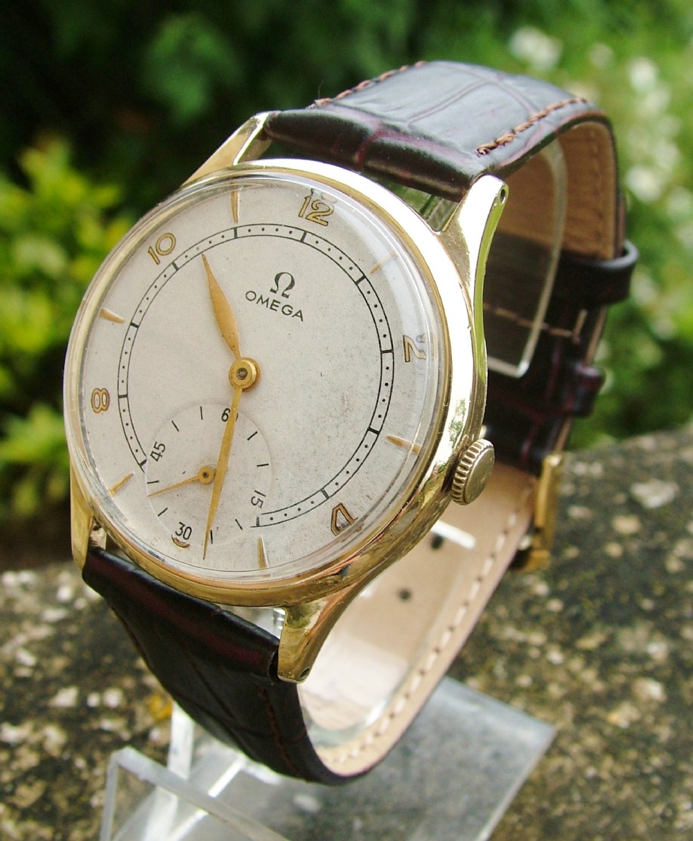 A gents 1940s 9 carat gold Omega wrist watch
