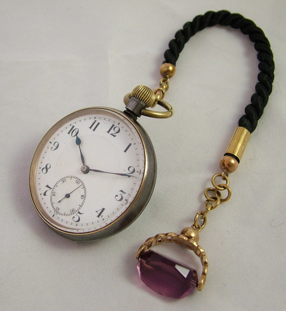 Antique gun metal cased pocket watch and albert