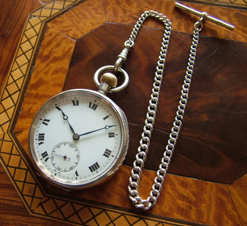 A World War 1 era silver pocket watch and chain