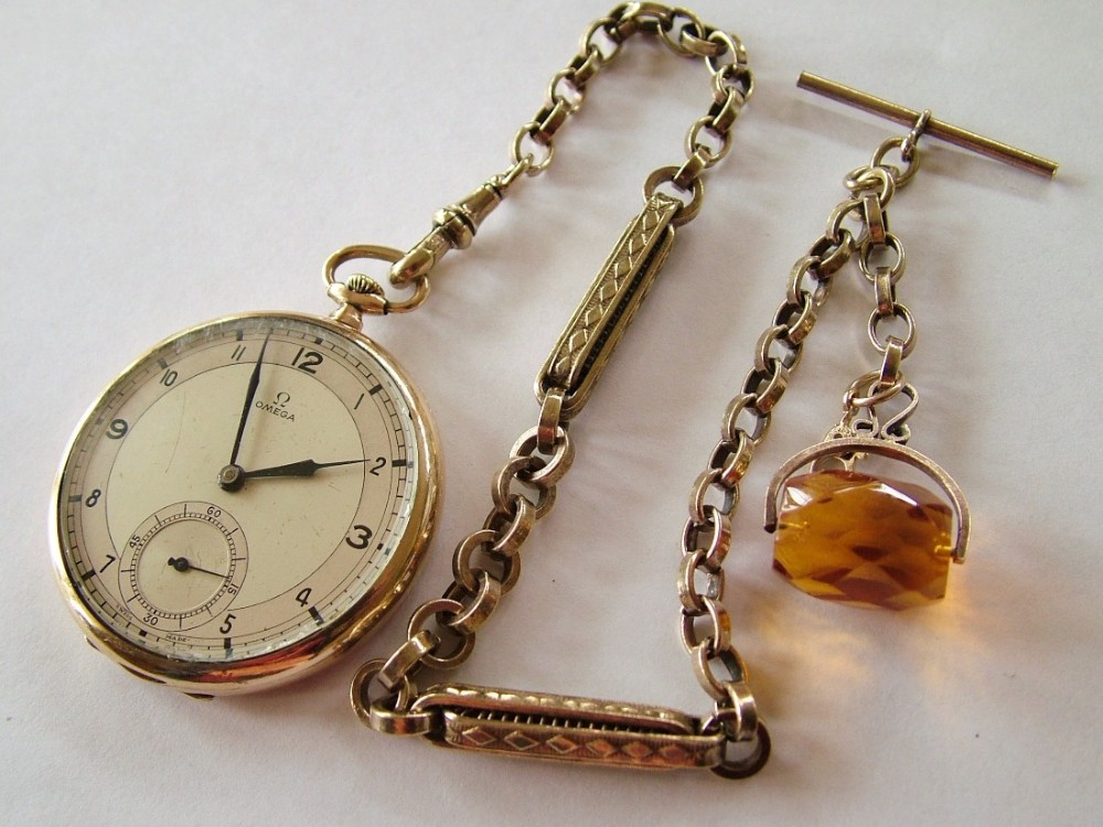 A 1930s Omega pocket watch and chain
